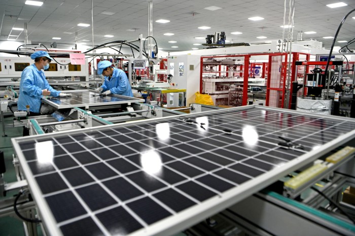 Solar panel production line workers in China. 